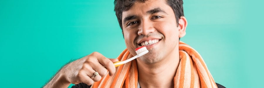 brushing teeth with a toothbrush