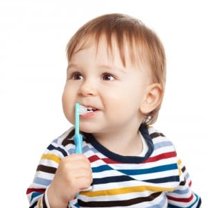 baby with a toothbrush