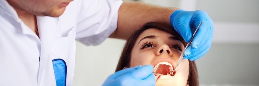 dentist applying tooth filling